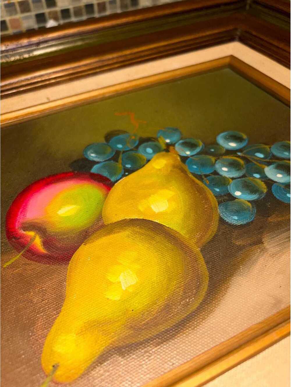 This is a vintage mid-century framed oil painting of fruit still life.